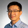 PG技术总监李先生的头像，戴着眼镜微笑